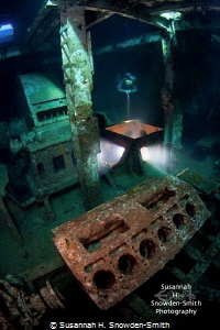 A diver explores the engine room of the ex-USS Kittiwake.... by Susannah H. Snowden-Smith 